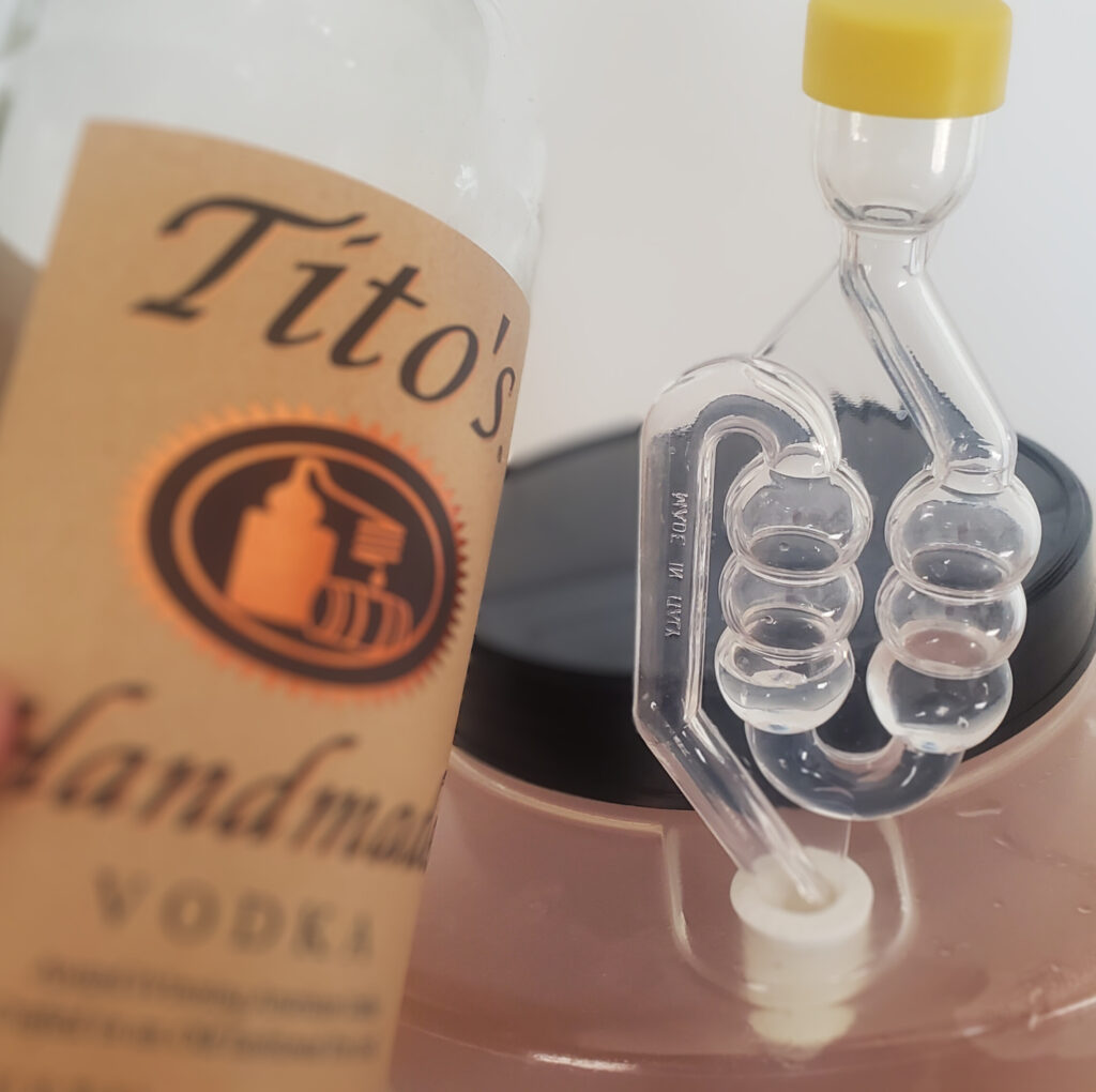 I used Tito's in the airlock for this carrot blossom mead, but I usually prefer to use a cheaper vodka.